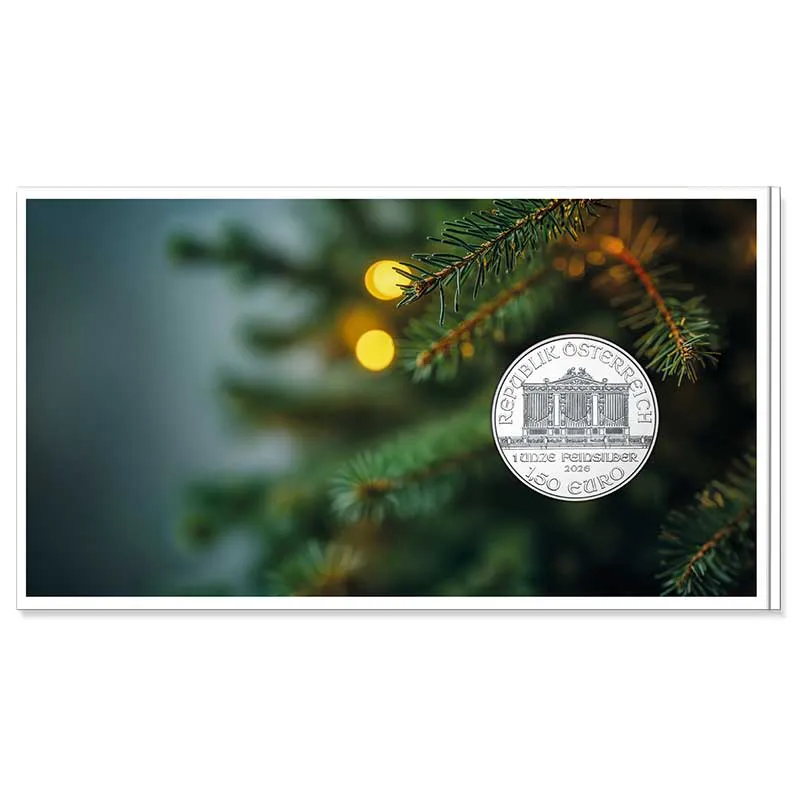 Die beliebte Weihnachtsedition der Silbermünze des Wiener Philharmonikers 1 Unze Silber 2026 im bebildertem Blister, Innenansicht mit Münzabbildung und Tannenzweigen